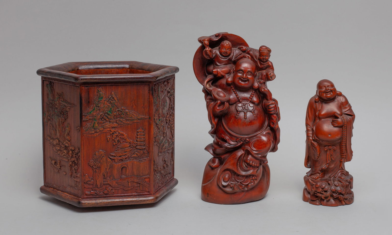 Estate Chinese Wood/ Bamboo Buddha: Including a brush pot of hexagonal section, carved with landscape scene on each side, a sculpture of Buddha, and a sculpture of Buddha and boys. Approx. 6.8-6.3-6 inch (brush pot size).