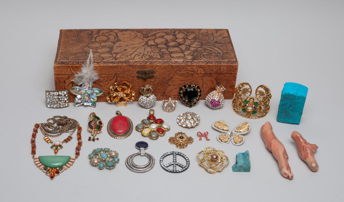 Estate Box of Costume Jewelry: Group of costume jewelry pieces and stone carvings, with a box. Size varies.