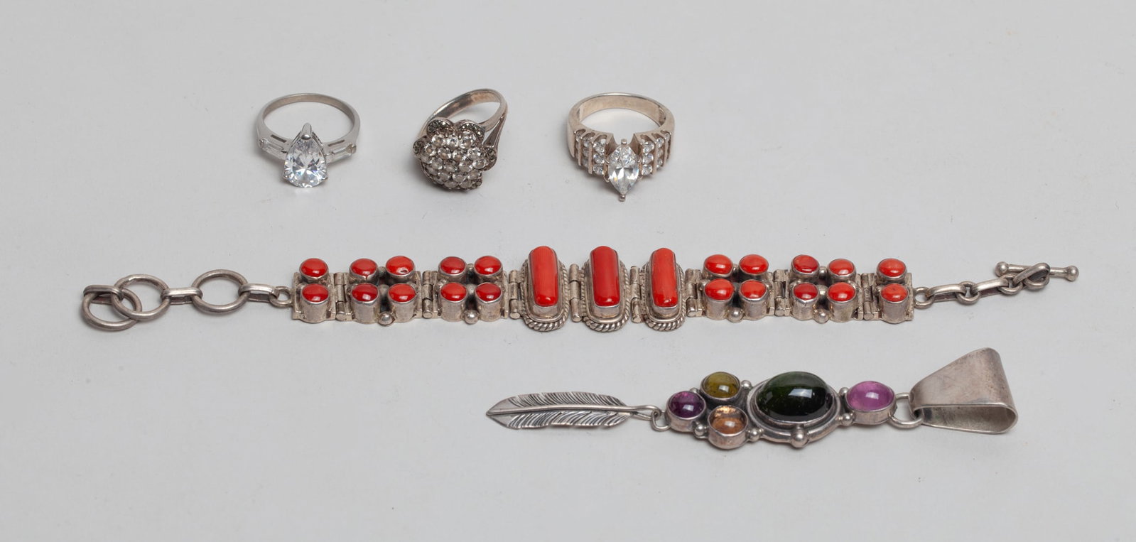 Estate Sterling Silver Jewelry: Including a bracelet, a pendant and three rings, decorated with stone and glass, the pieces marked 925 or STERLING. Approx. 73 gram (total weight).