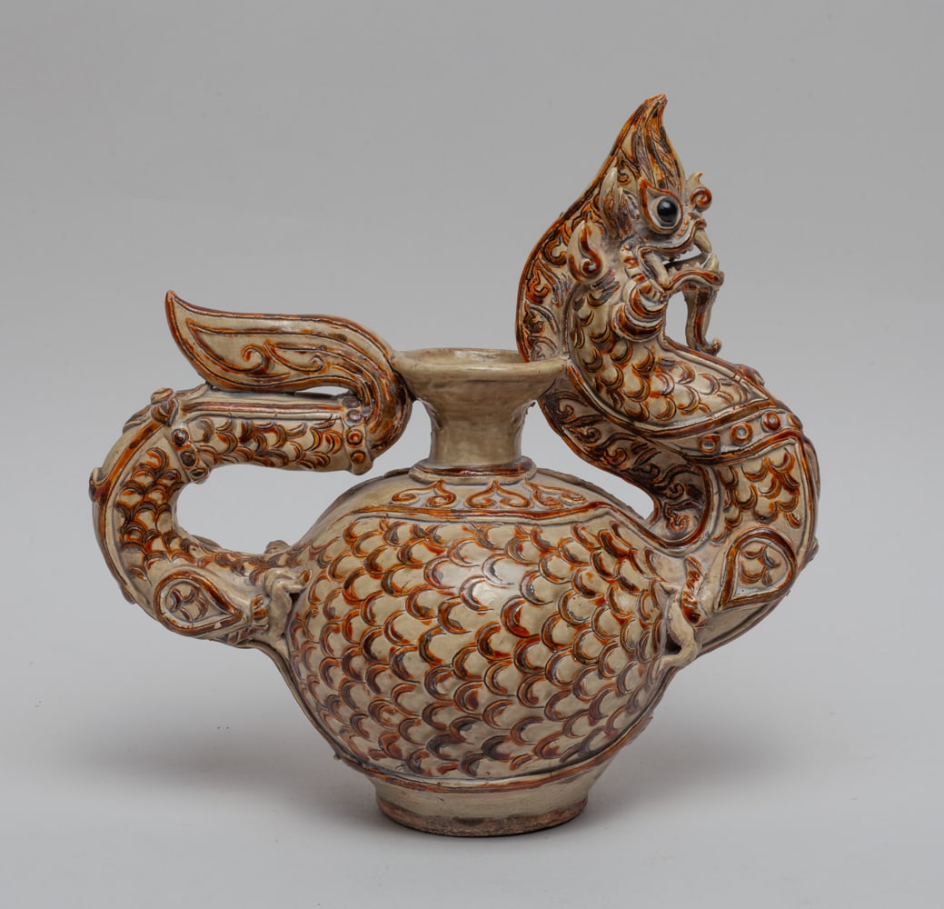 Collectible South Asian Porcelain Pot: Moulded in special sinuous dragon form, the globular body carved with overlapping scale. Approx. 9.5-9.3-5 inch.
