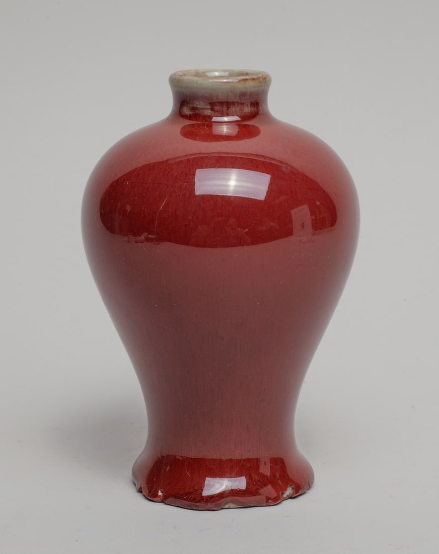 Chinese Red Glazed Porcelain Cabinet Vase: Of waisted baluster form, the exterior applied in streaked red glaze. Approx. 5-3.3 inch.
