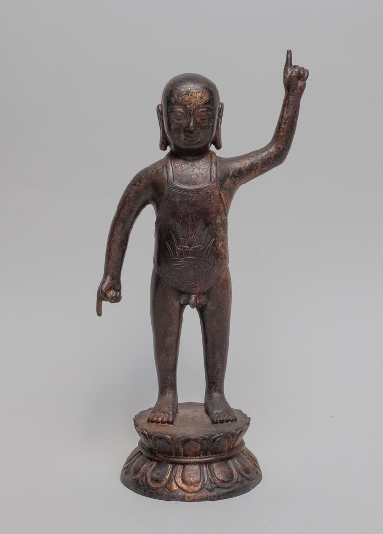 Chinese Painted Metal Buddha: The painted metal Buddha standing on a double lotus base, with left hand pointing upward and right hand pointing downward. Approx. 11.4-5.7-4 inch.