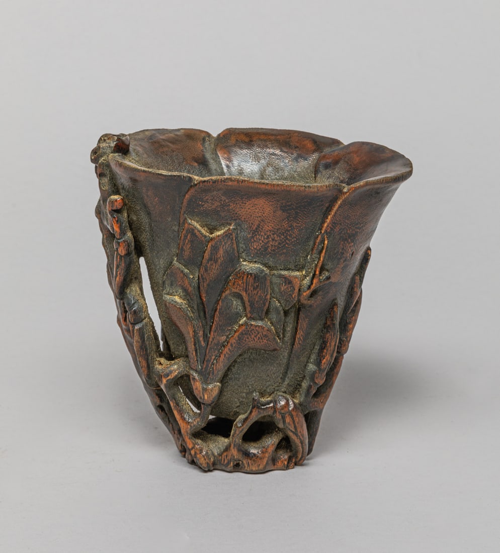 Chinese Bark of Agarwood Cup: Collectible bark of agarwood cup, the exterior carved in high relief with flowers and leafy stem as handle. Approx. 106 gram.
