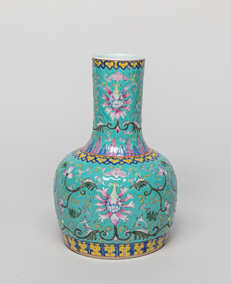 Chinese Famille Rose Porcelain Vase: The vase exterior enameled with lotus scrolls on turquoise-glazed ground, interspersed with bats, shou characters and swastika symbols. Approx. 8.1-5.2 inch.