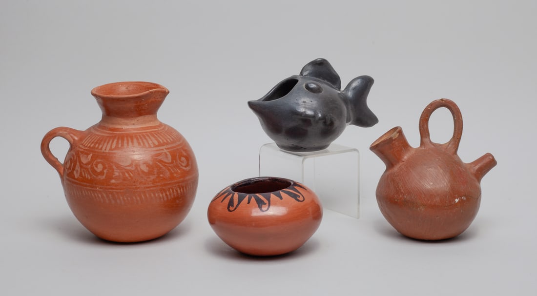 Native American Type Pottery Piece: Group of four Native American style pottery pots, applied in brown or black glaze. Approx. 6-5.7 inch (largest).