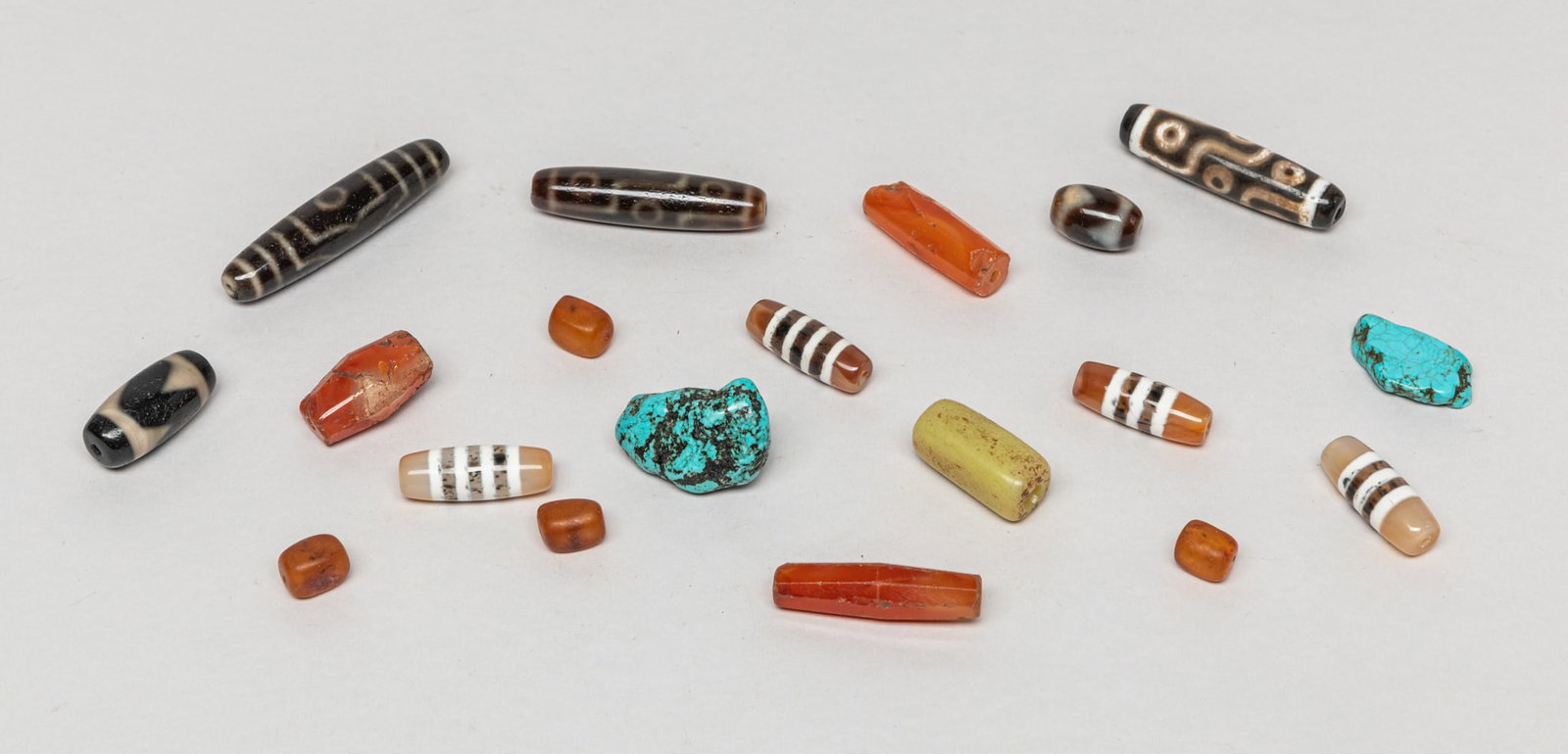 Mixed Chinese/ Tibetan Beads: Including a set of Chinese/Tibetan beads. Varies in size and kind.
