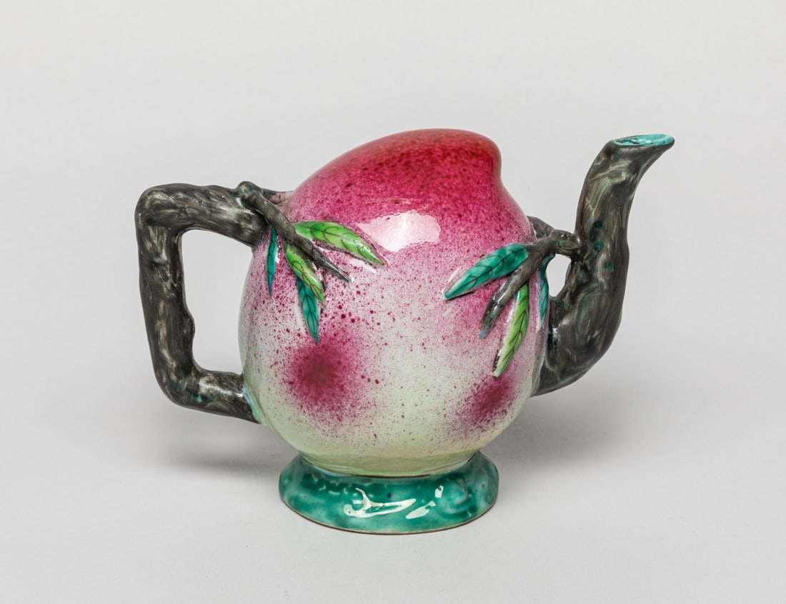 Chinese Famille Rose Porcelain Pot: A Chinese famille rose porcelain pot in vivid peach form, two "peach-branch" designed as a handled and a spout, bottom with deep hole. Approx. 7-3.5-5.2 inches.