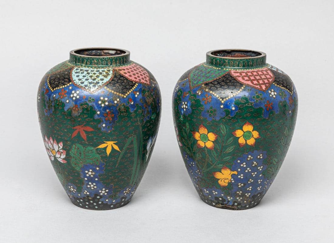 Pair Japanese Edo Period Cloisonne Urns: A pair of collectible Japanese Edo period cloisonnes urns decorated with lotus and other elements. Approx. 5-6.5 inches. _x000d__x000d_The Estate of the Closed Personal Museum of Kansas City, 1995.