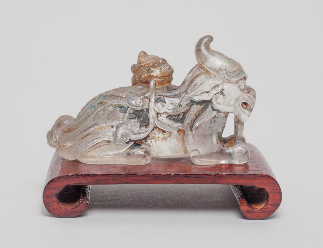 Chinese Peiking Glass Brush Stand: Crouching beast with its baby climbing on back with a Chinese-traditional cloud-shape in mouth, with a wooden stand. Approx.. 1.7 - 1.2 - L 3.1 inch (without stand)