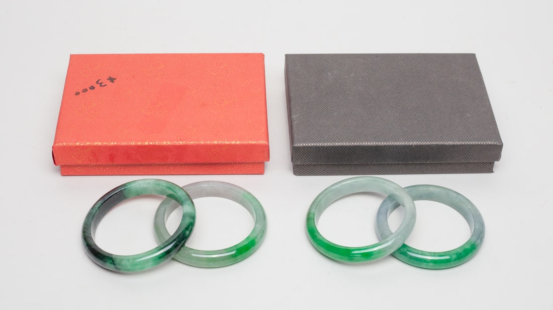 Two Boxes of Chinese Jade Bangles: Two boxes of Chinese jade bangles, both with a box. Approx. Outer diameter 2.9 inch, inner diameter 2.3 inches.