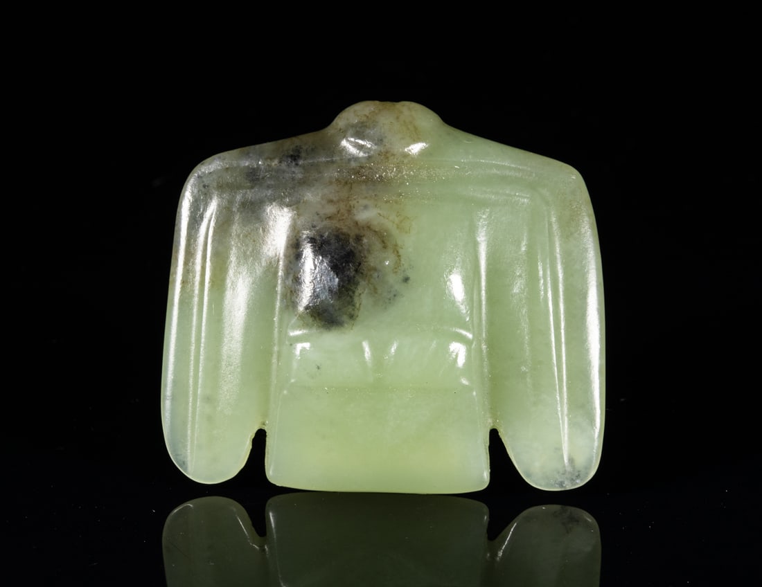 Chinese Pale Celadon Jade Carved Bird: One collectible Chinese jade, in the color of pale celadon with black inclusions, carved in form of a bird, pierced an aperture at the neck. Approx. 2.0-1.7-0.6 inches.