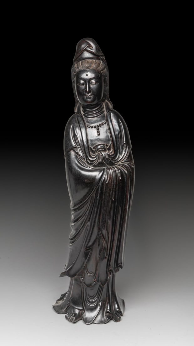 Tall Chinese Zitan Like Wood Kuanyin: One collectible Chinese tall Zitan-like wood Kuanyin standing-pose sculpture, in medication impression on the face, with a fine combed hair. Approx. 6.5-5.0-22.5 inches.