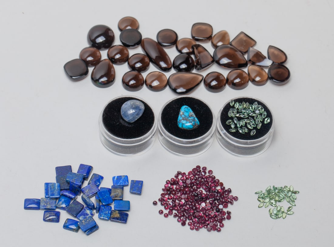 Garnet, Crystal, Lapis & Turquoise Cut Stones: A collection group, including garnet, crystal, lapis and turquoise cut stones. Sizes vary. The Estate of Store Closed Sale in DTLA.
