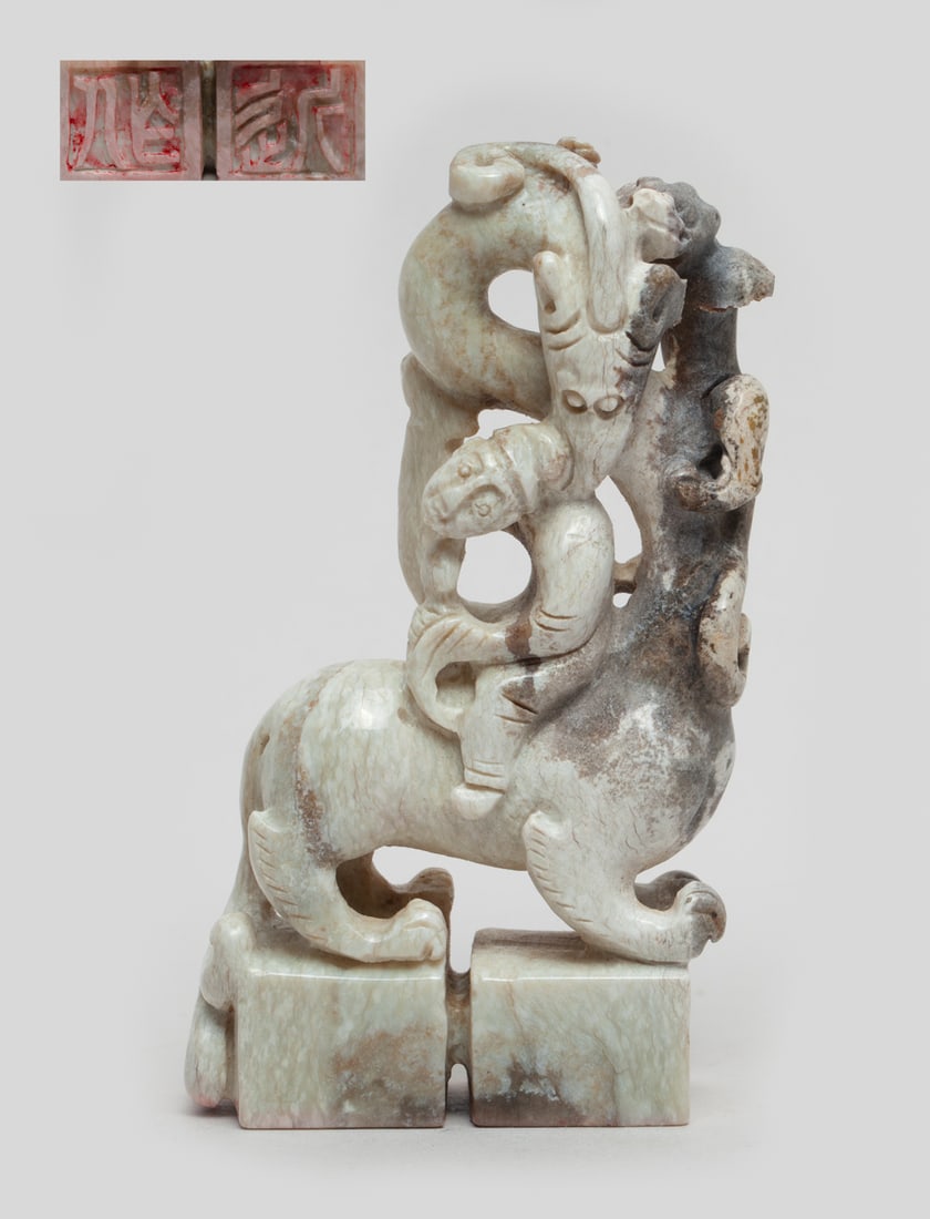 Lg Chinese Chicken Bone Jade Seal Sculpture: One Chinese chicken bone jade seal sculpture, carved in a figure ridding on a beast with a small one climbing on its long sinuous neck, two attached seal faces carved with characters at the bottom. Ap