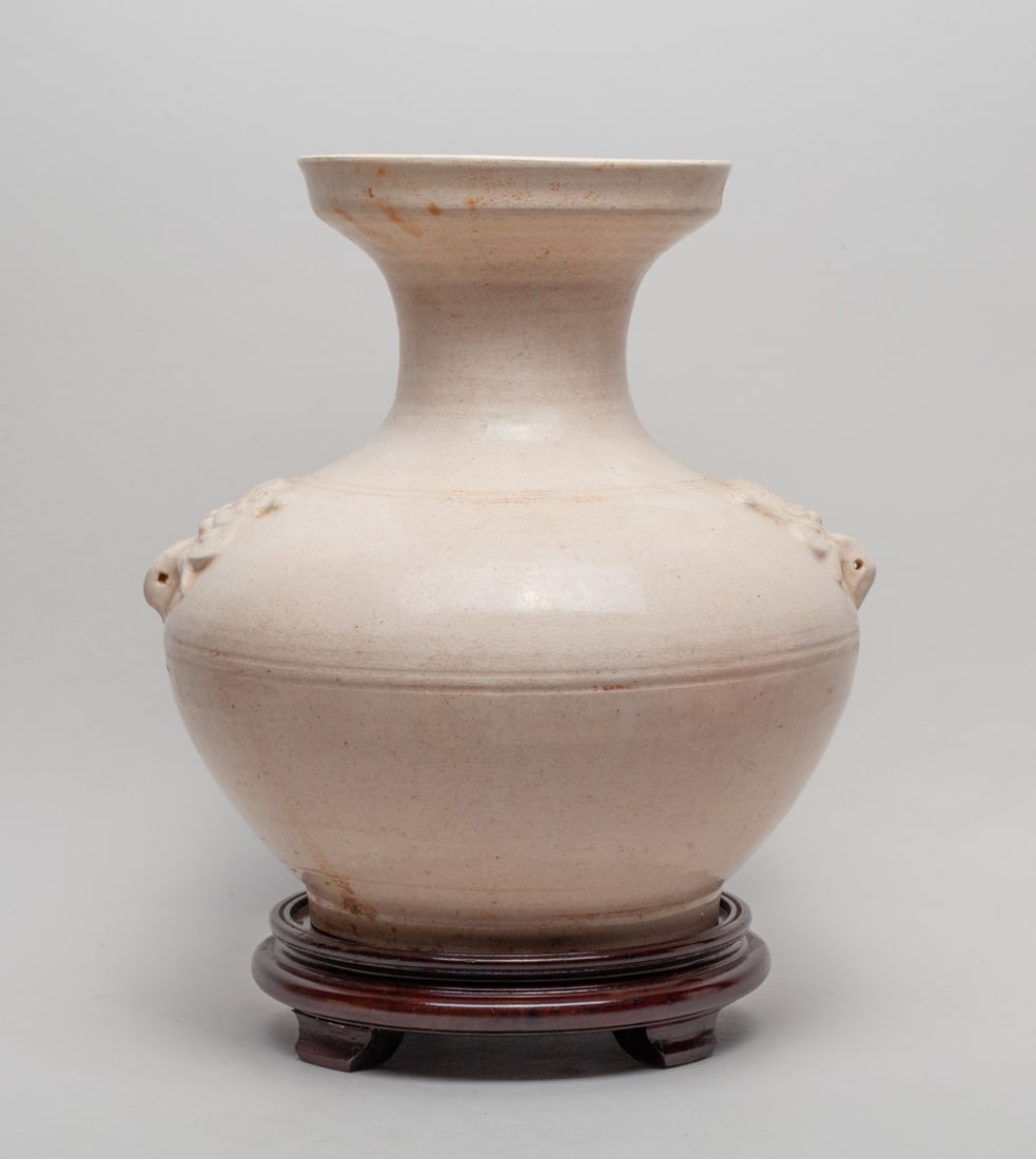 Lg Chinese White Glazed Porcelain Vase: Chinese porcelain vase covered n white glaze suffused with a matrix of crackles, set with two raised beast mask handles at the shoulder, with a wooden stand. Approx.11.0-15.0 inches (W/O stand).