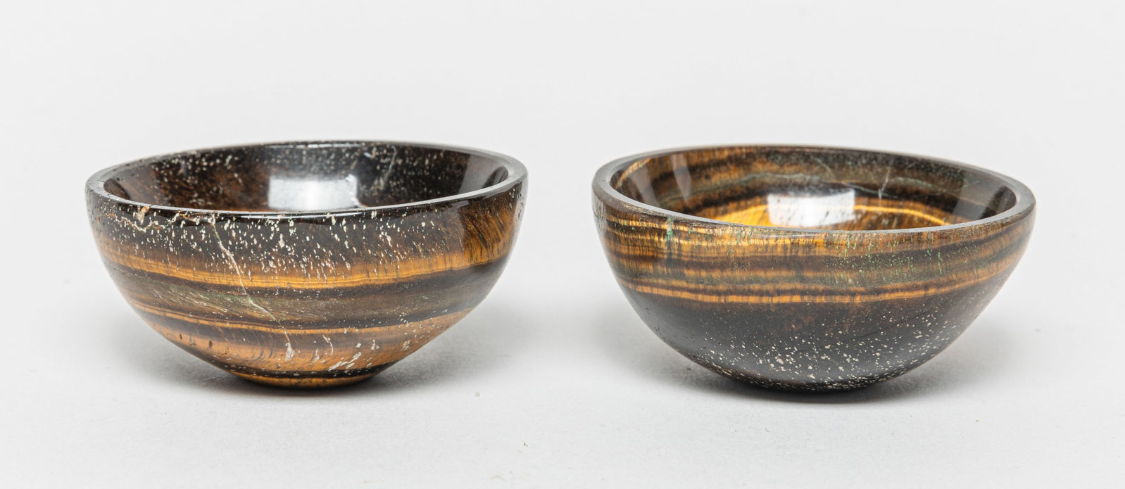 Two Tiger-eye Gemstone Cups: Two tiger-eye gemstone cups. Approx. 2.6-1.4 inches (Each).