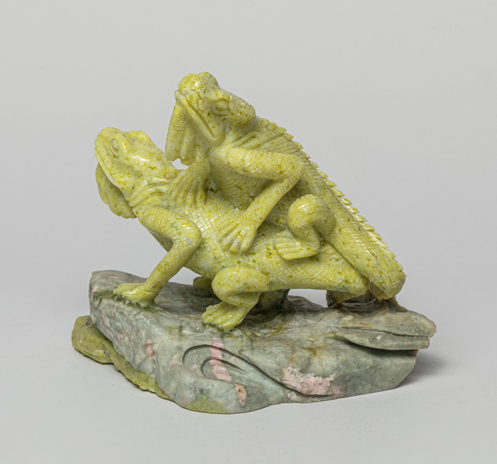 Art Gemstone Sculpture: The gemstone carved with a lizard walking on a rock with another one at the back. Approx. 7.5-4.5-6.5 inches.