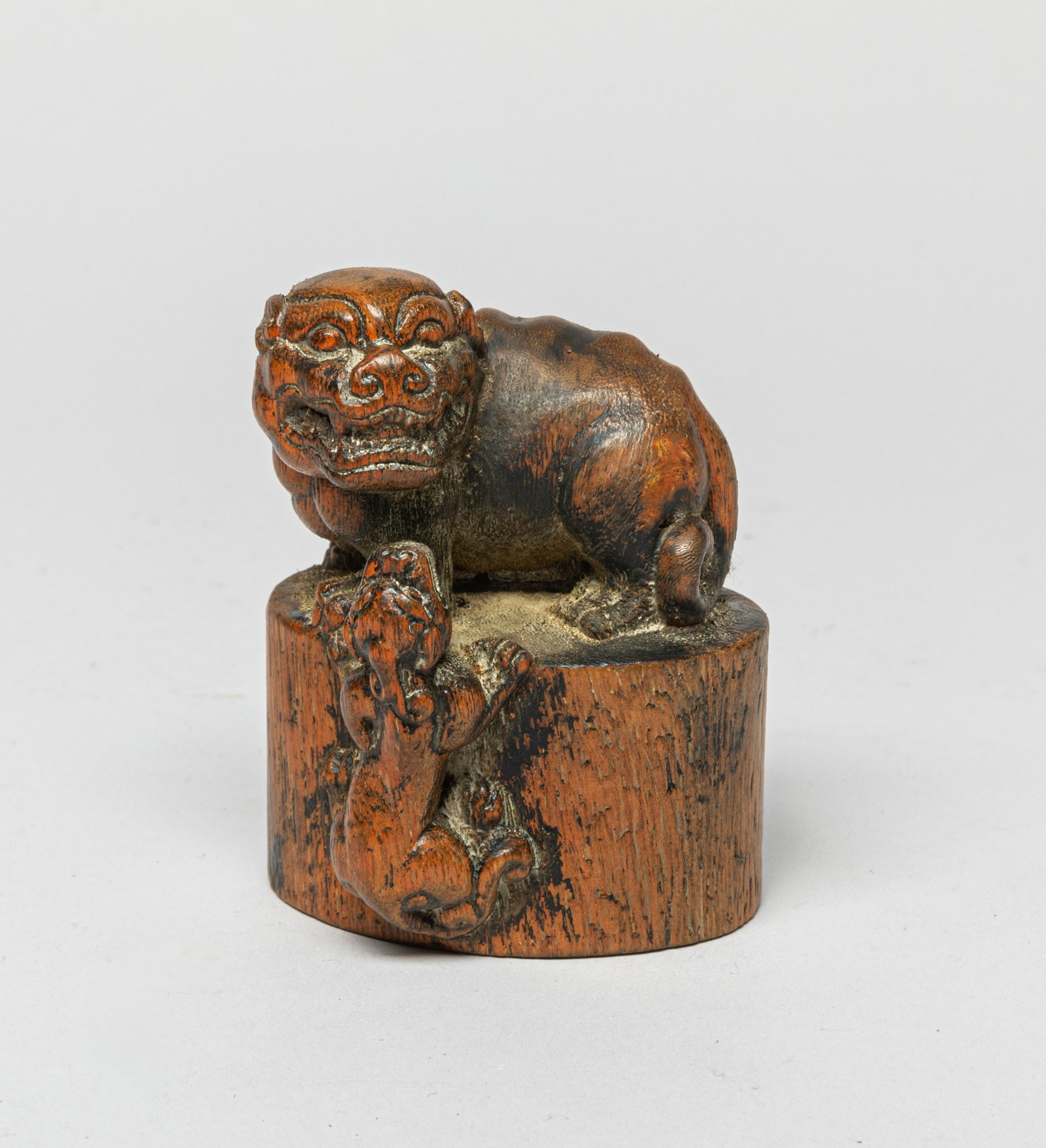Large Chinese Bamboo Seal: The seal carved with a small beast climbing on the side looking up to a larger one on the top. Characters carved at the seal face. Approx. 2.6-2.2-3.5 inches.