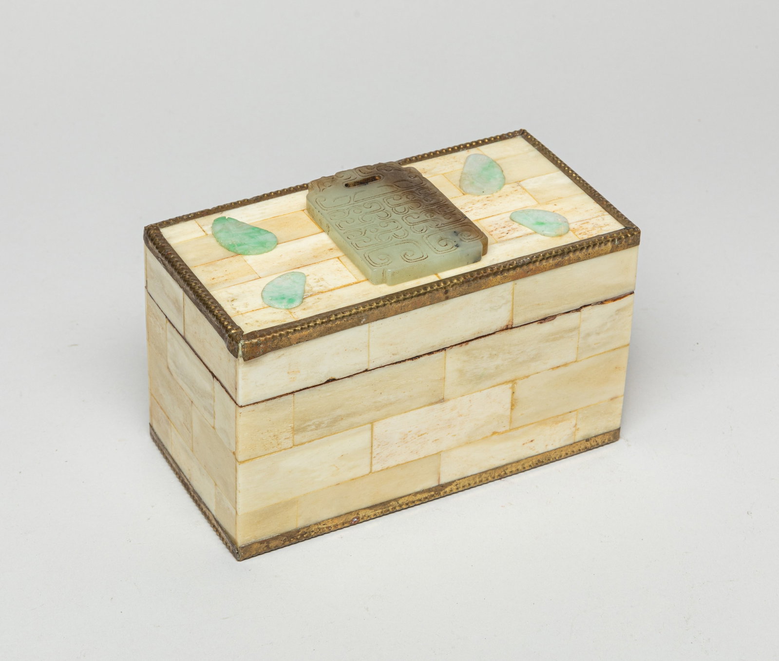 Chinese Export Bone Box Inlaid Jade: The box adorned with a rectangular jade plaque carved with traditional patterns and four small pieces at each corner. Approx. 6.1-3.1-4.1 inches.