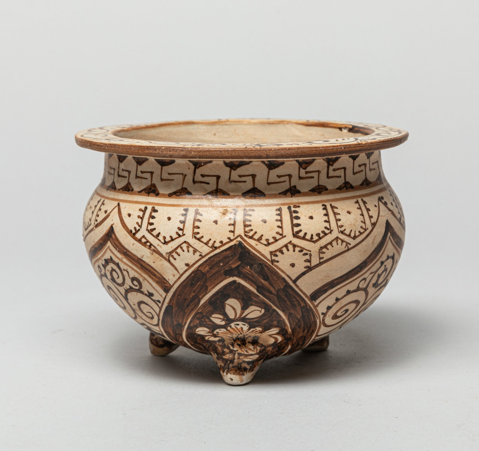 Chinese Cizhou Porcelain Censer: The hemispherical body surmounted a short neck with a flat-flaring rim, the shaped panels decorated with floral motif, and the cover topped a finial. Approx. 4.6-3.2 inches.