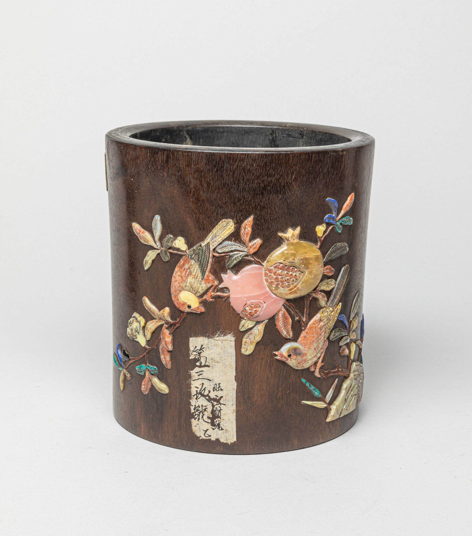 Chinese Wood Brush Pot Inlaid Gemstone: The collectible brush pot decorated with gemstone birds sitting on pomegranate branches, adorned with a seal mark beside. Approx. 6.4-7.0 inches.