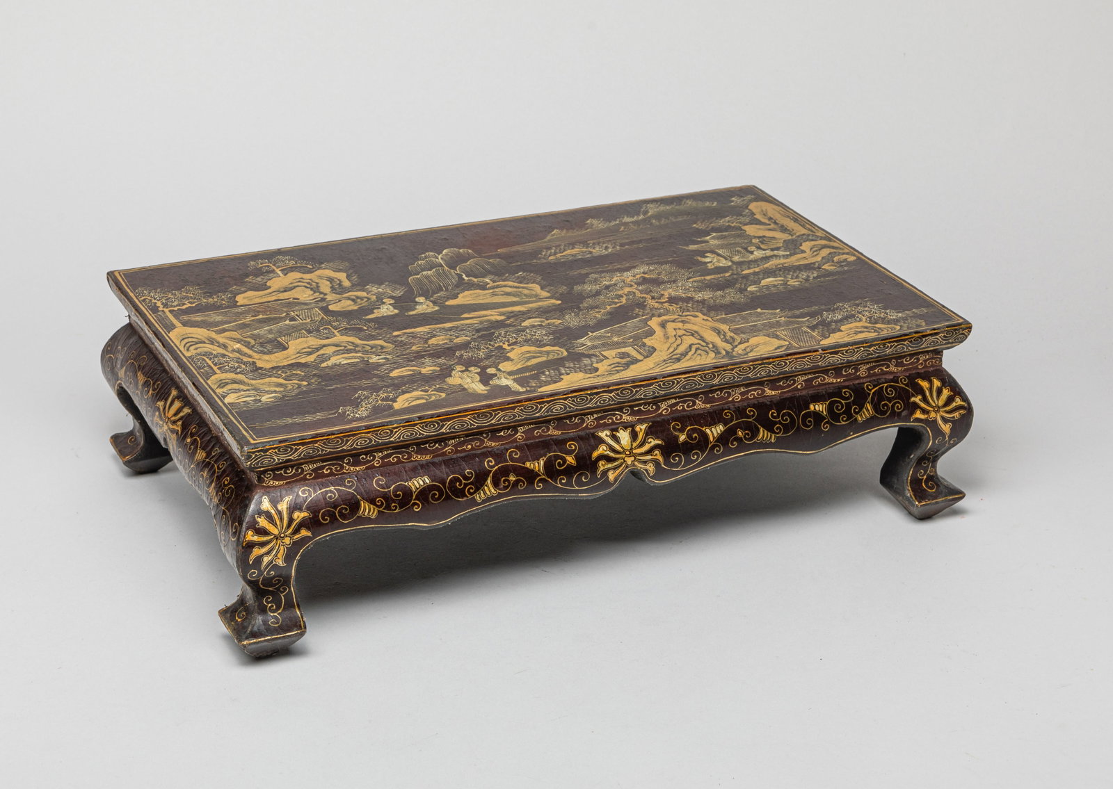 Lg Chinese Lacquer Stand: Of rectangular form with curved short legs, exterior painted figures in a landscape setting, scrolling leafy motif painted at each side, and the bottom with a six-character mark. Approx. 15.7-9.5-4.5 