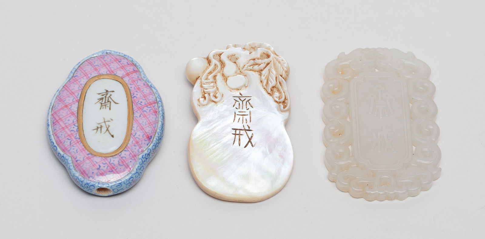 Chinese Jade, Porcelain & MOP Plaques: Including one porcelain plaque in purple tone and painted with characters in the center, one rectangular plaque carved with two dragons as the frame, and one MOP plaque carved in gourds form. Approx.