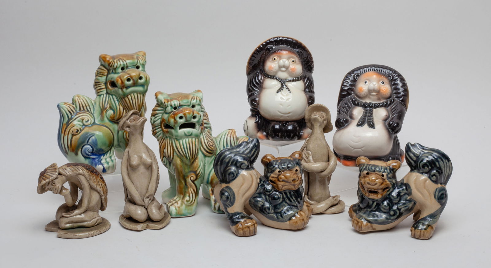 Vintage Japanese Stoneware Figures: A set of vintage Japanese stoneware figures. Size varies.