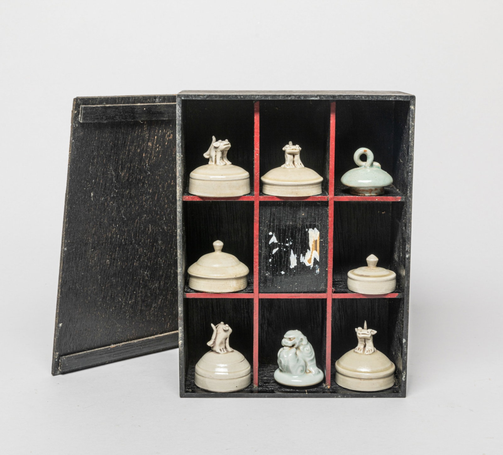 Estate Chinese Porcelain Covers: Group of 8 porcelain covers, applied in beige or gray glaze, wherein 5 covers set with beast finial, with box. Size varies.