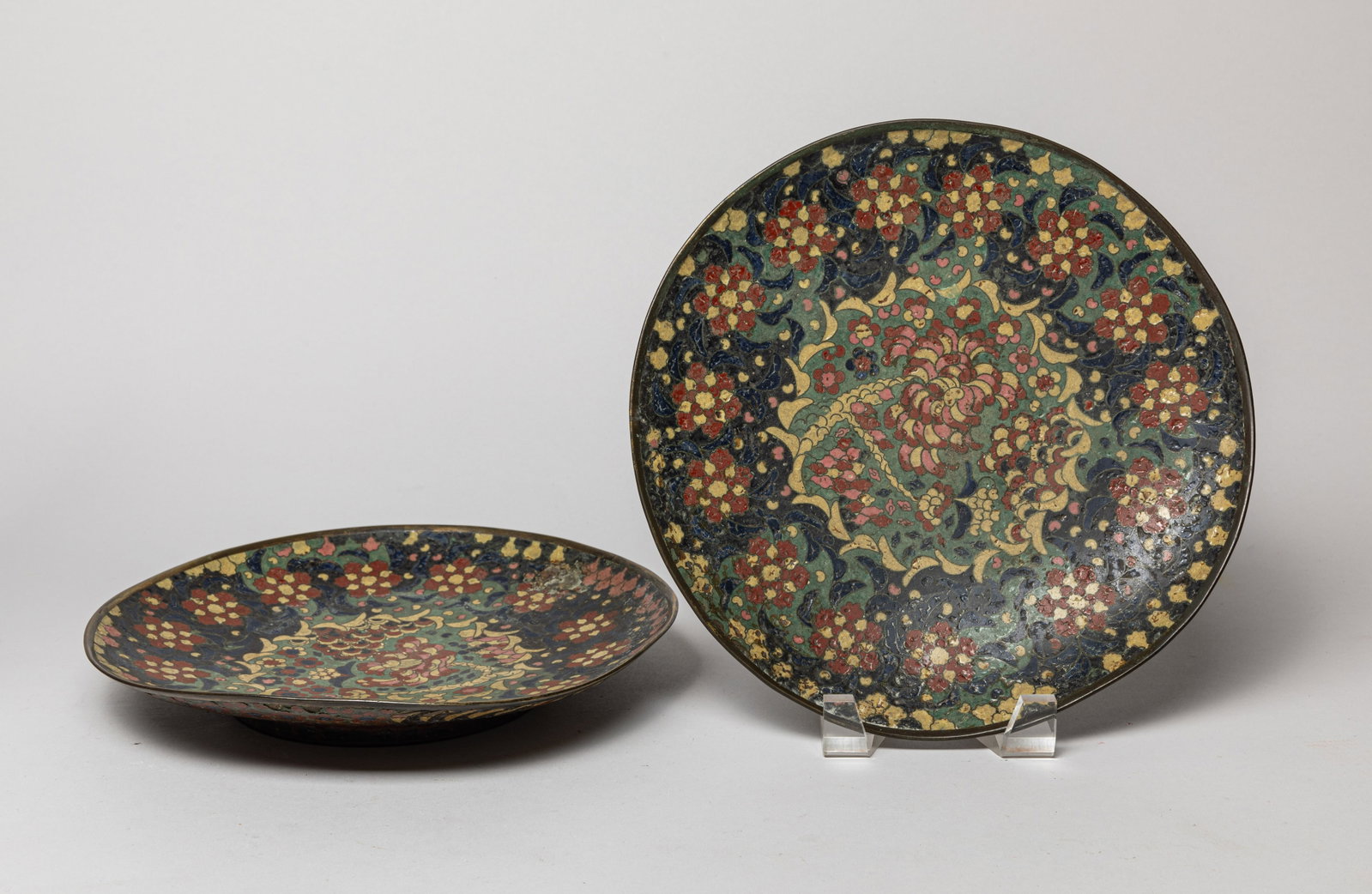 Two Japanese Edo Cloisonne Plates: The plates enameled with blossoming flowers around the top and underside. Approx 10inch W. (larger).