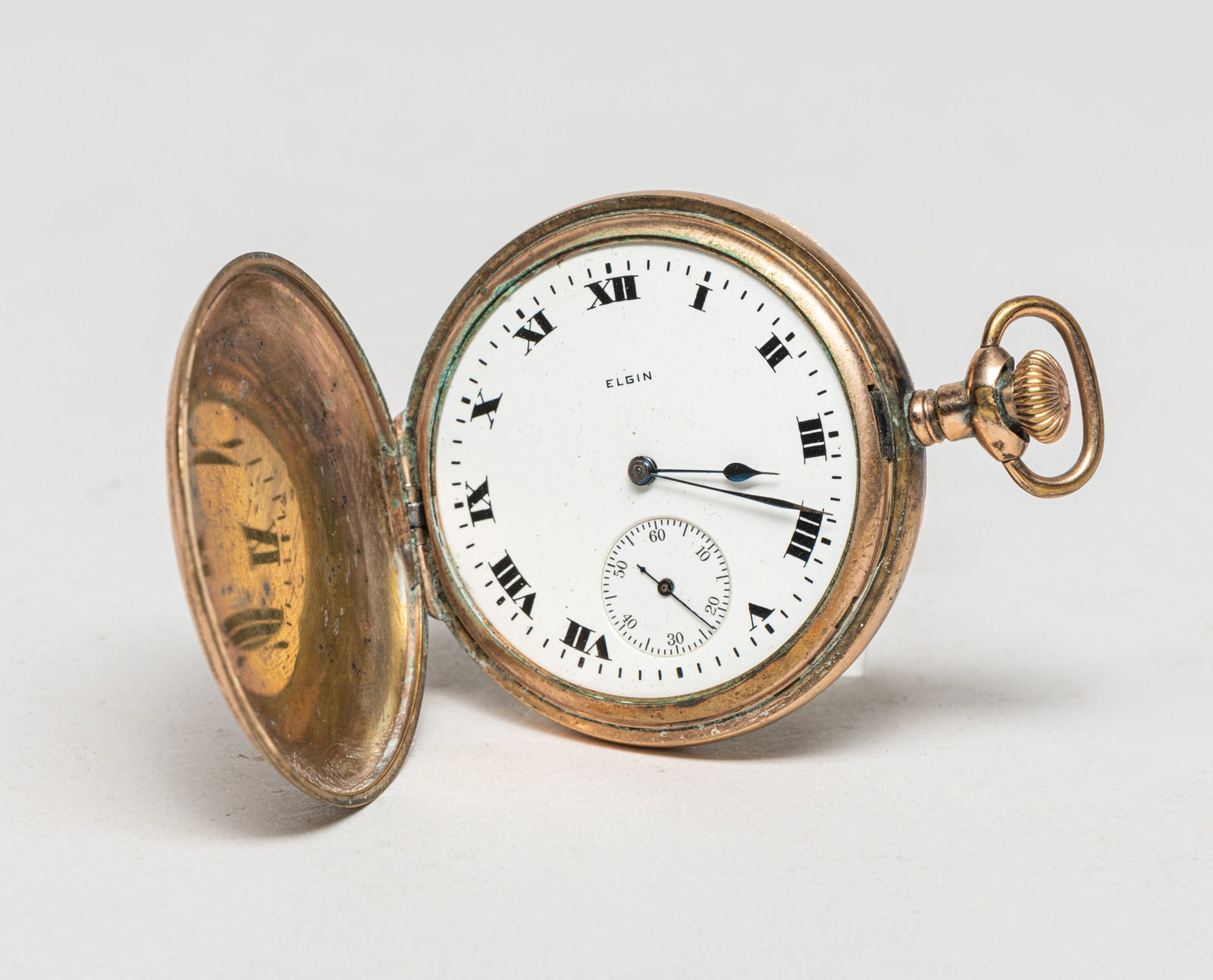 Gold Filled Pocket Watch: Vintage gold-filled pocket watch, engraved with complicated foliage pattern, with the dial marked ELGIN. Approx. 2.5*2 inch.