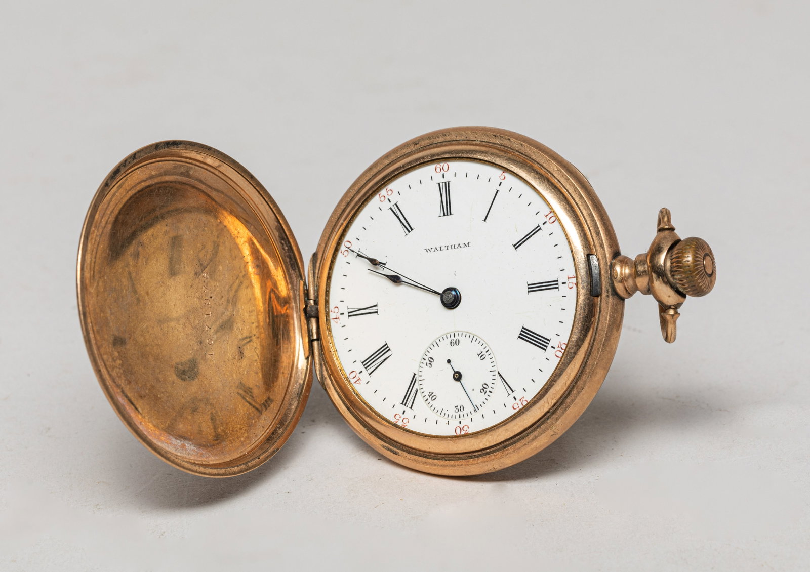 Collectible Gold Filled Pocket Watch: Vintage gold-filled pocket watch, engraved with floral pattern, with the dial marked WALTHAM. Approx. 2.5*2 inch.