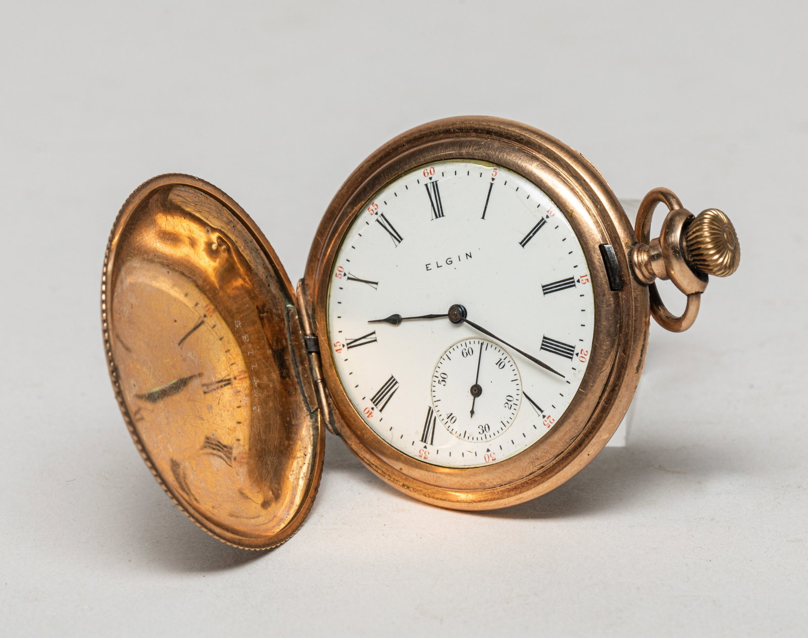 Gold Filled Pocket Watch: Vintage gold-filled pocket watch, engraved with foliage and countryside pattern, with the dial marked ELGIN. Approx. 2.3*1.9 inch.