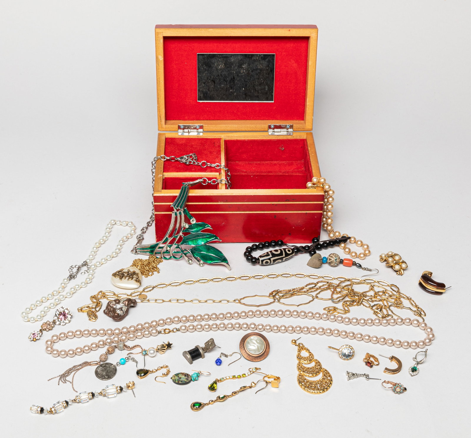 Estate Costume Jewelry: Including necklaces, earrings, brooches, and bracelets, with a jewelry box. Size varies.
