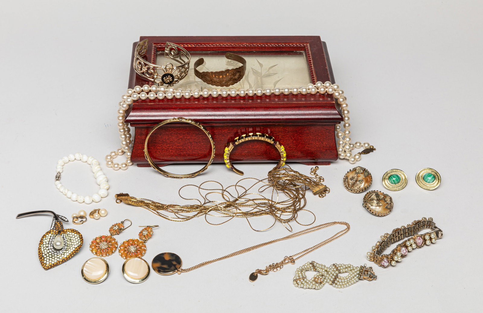 Estate Costume Jewelry: Including necklaces, bangles, earrings, bead bracelet and brooch, with a jewelry box. Size varies.
