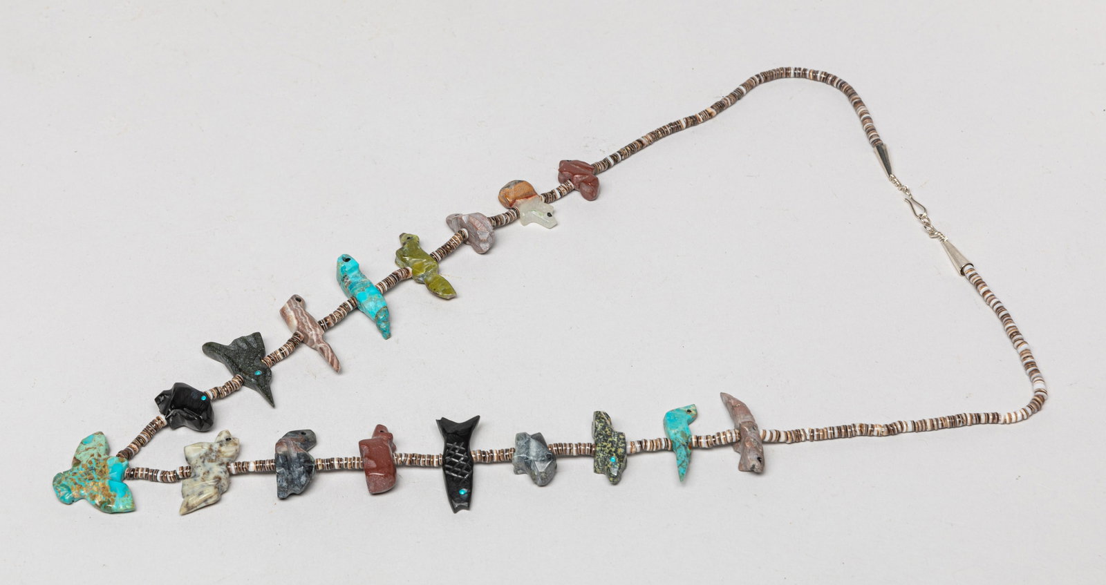 Vintage American Indian Navajo Necklace Jewelry: Native American Navajo heishi bead necklace with multi-gemstone carved pendants in various animal form. Approx. 26inch L.