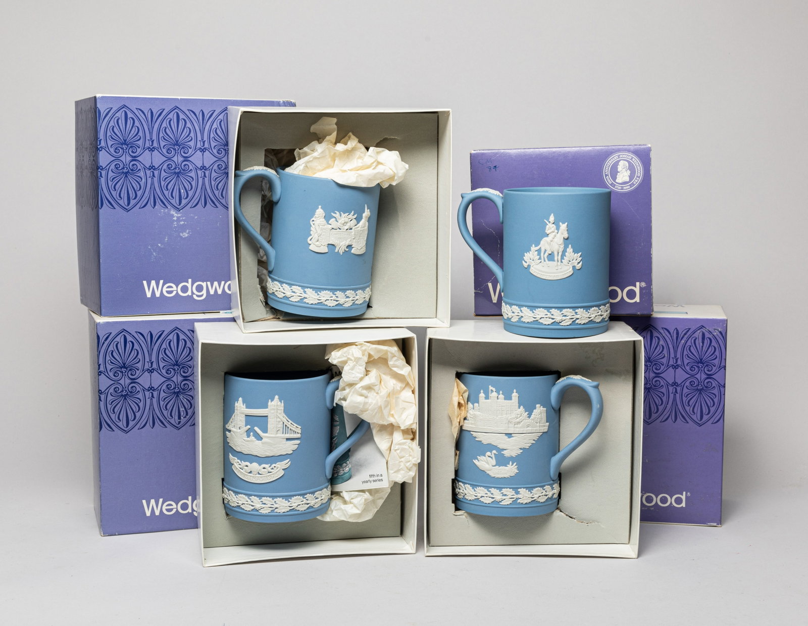 Set Wedgwood Jasper Ware Pieces: Set of four Wedgwood jasper ware mugs, with boxes. Size varies.