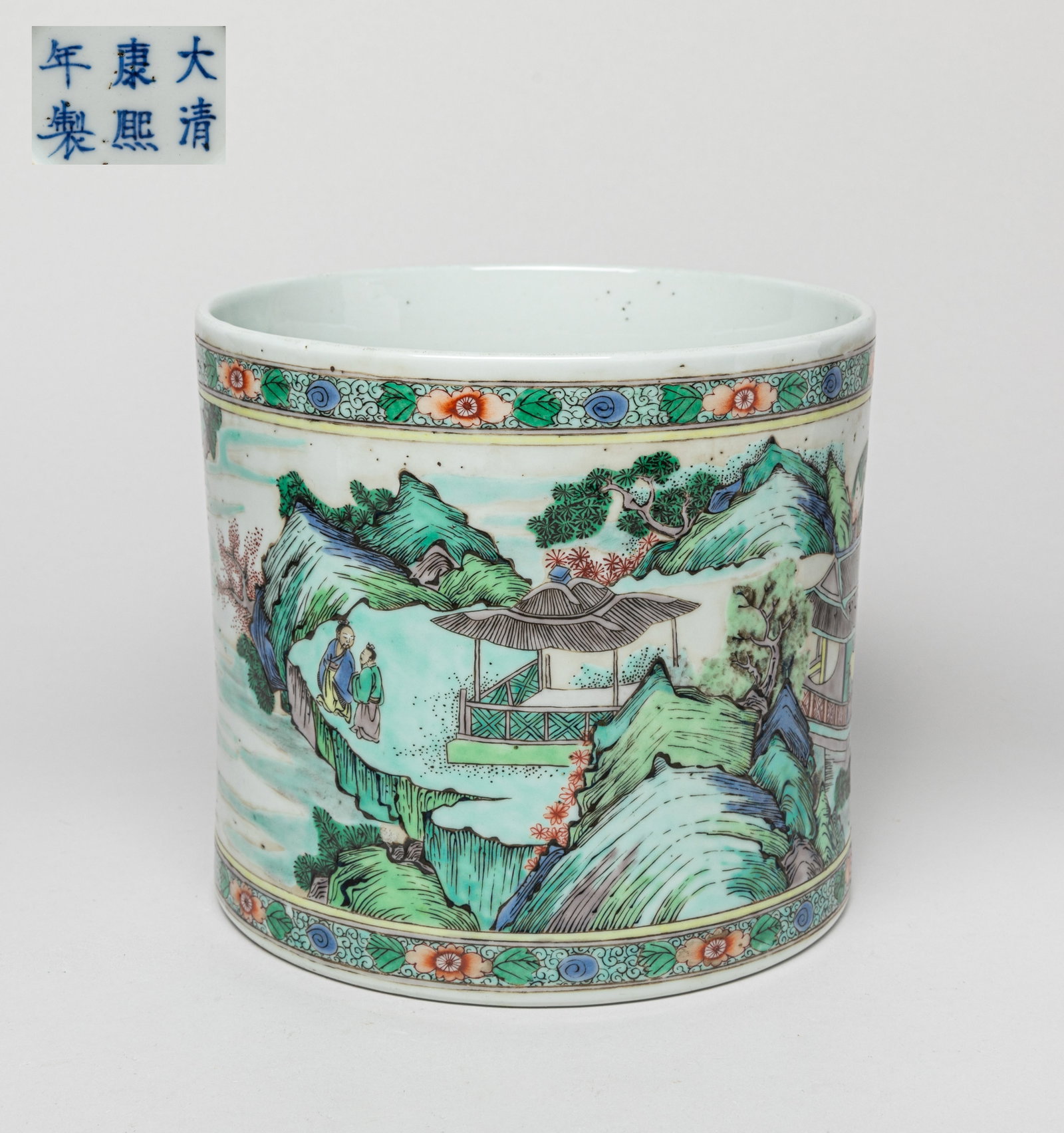Chinese Wuchai Porcelain Brush Pot: Of cylindrical form, the exterior painted with a continuous landscape scene, the base inscribed with a six-character mark. Approx. 6.7-7.1 inches