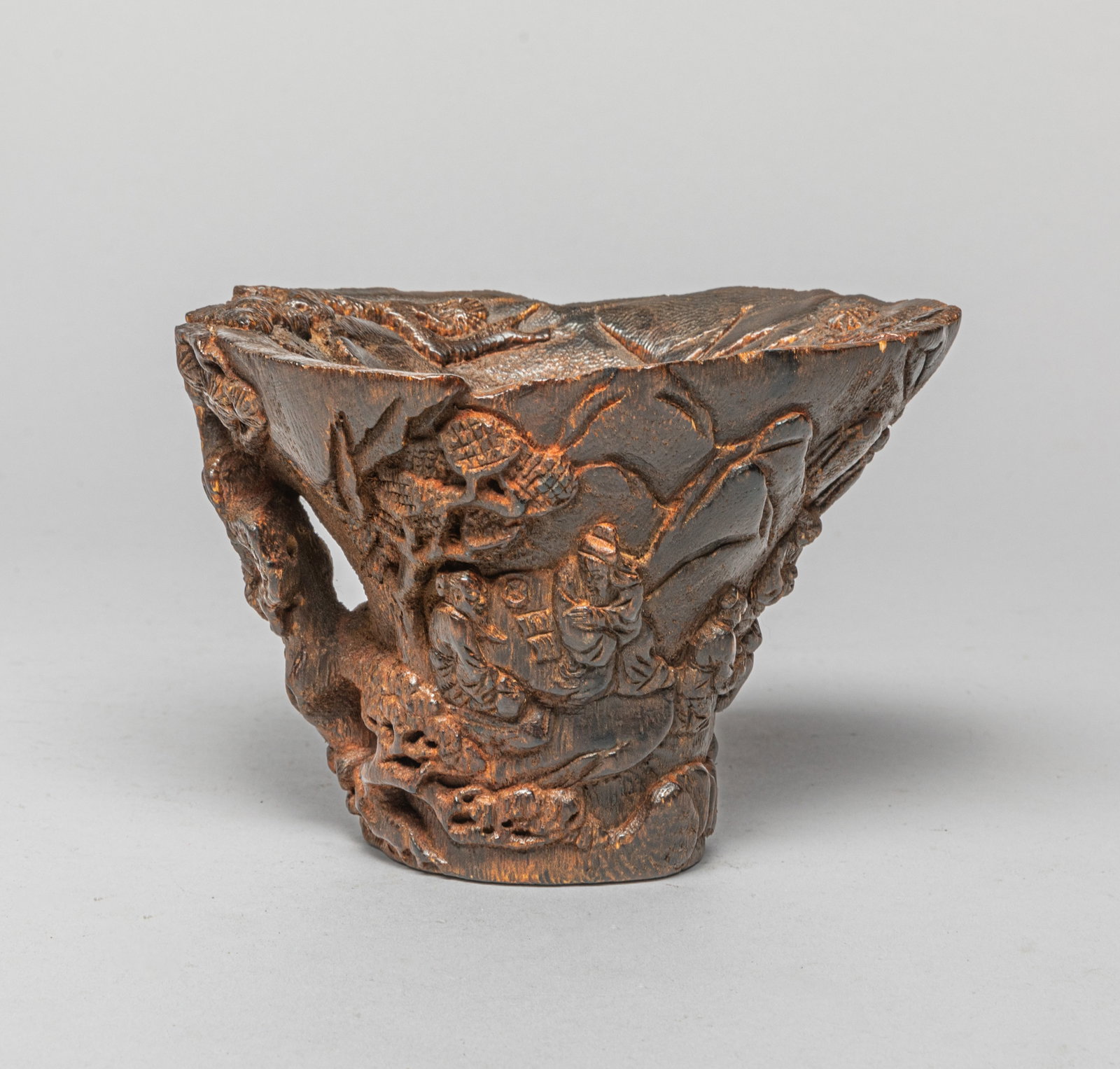 Chinese Bark of Wood Cup: Chinese wood bark cup carved scholars and their servants in various activities amongst pine trees and rocks. Approx. 5.4*3.5*3.8 inch.