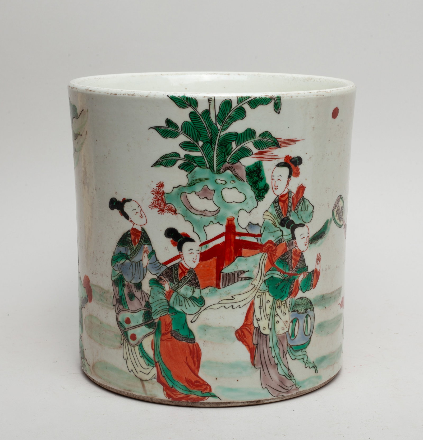 Chinese Wuchai Porcelain Brush Pot: Of cylindrical form, the brush pot exterior painted with a colored figural scene set in a garden setting. Approx. 8.0-8.0 inches.