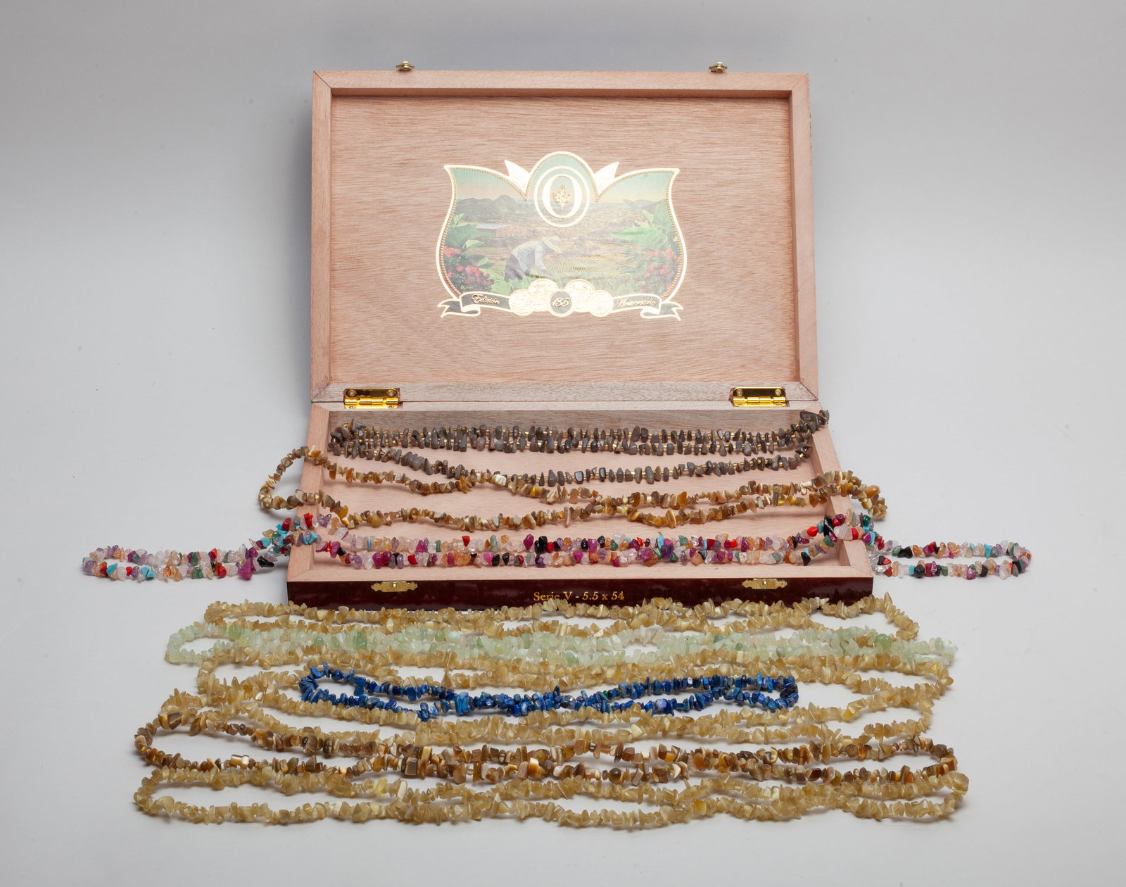 Mid-century Gemstone Jewelry: Group of 10 multi-gemstone carved necklaces, with box. Size varies.