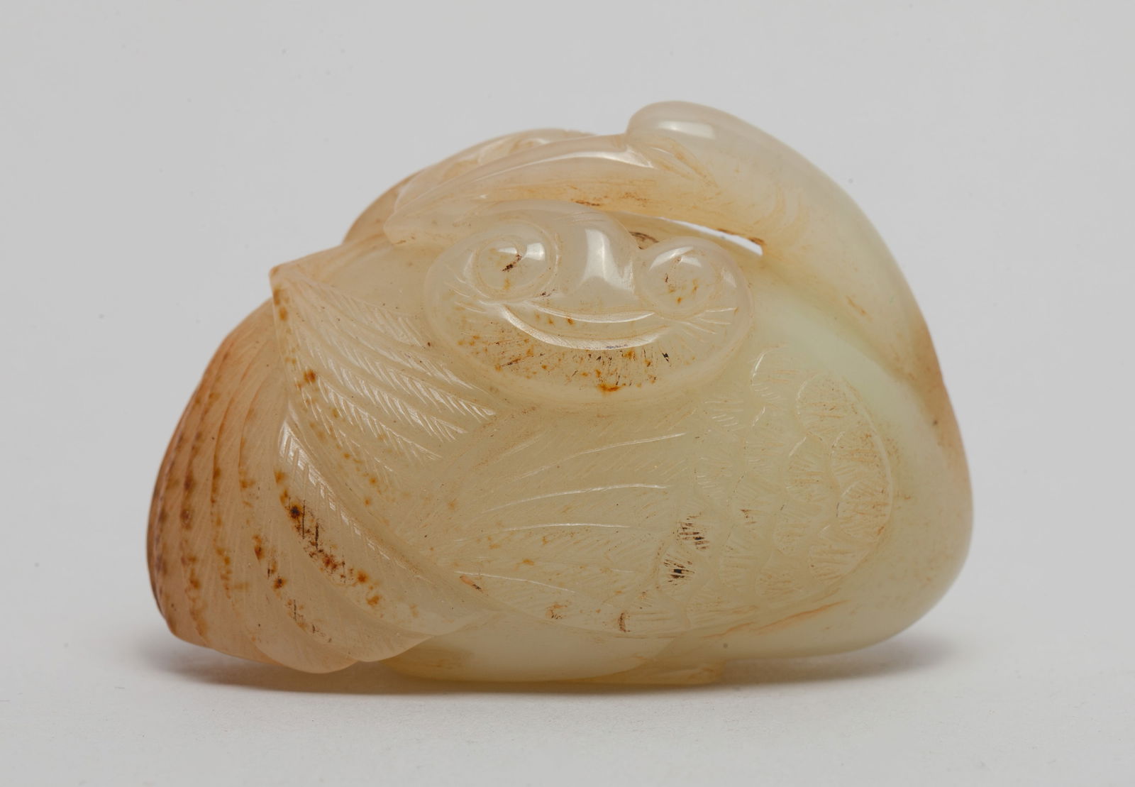 Chinese Russet Jade Goose: Chinese russet jade goose, the head turned sharply backwards and the long beak clasping ruyi. Approx. 2.2*1.25*1.55 inch.