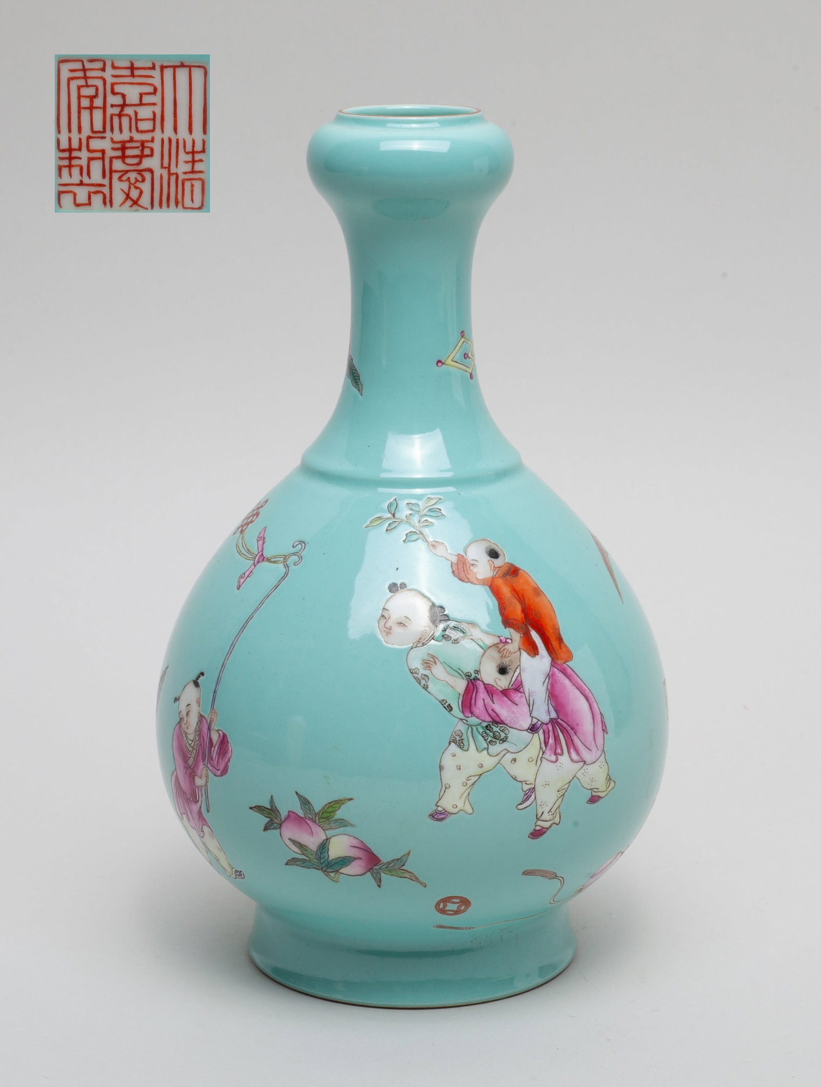 Chinese Enameled Porcelain Vase: Of pear shape rising from a splayed foot to a waisted neck and inverted mouth, the exterior enameled with boys playing games on a turquoise-glazed ground, the bottom with a six-character mark. Approx.
