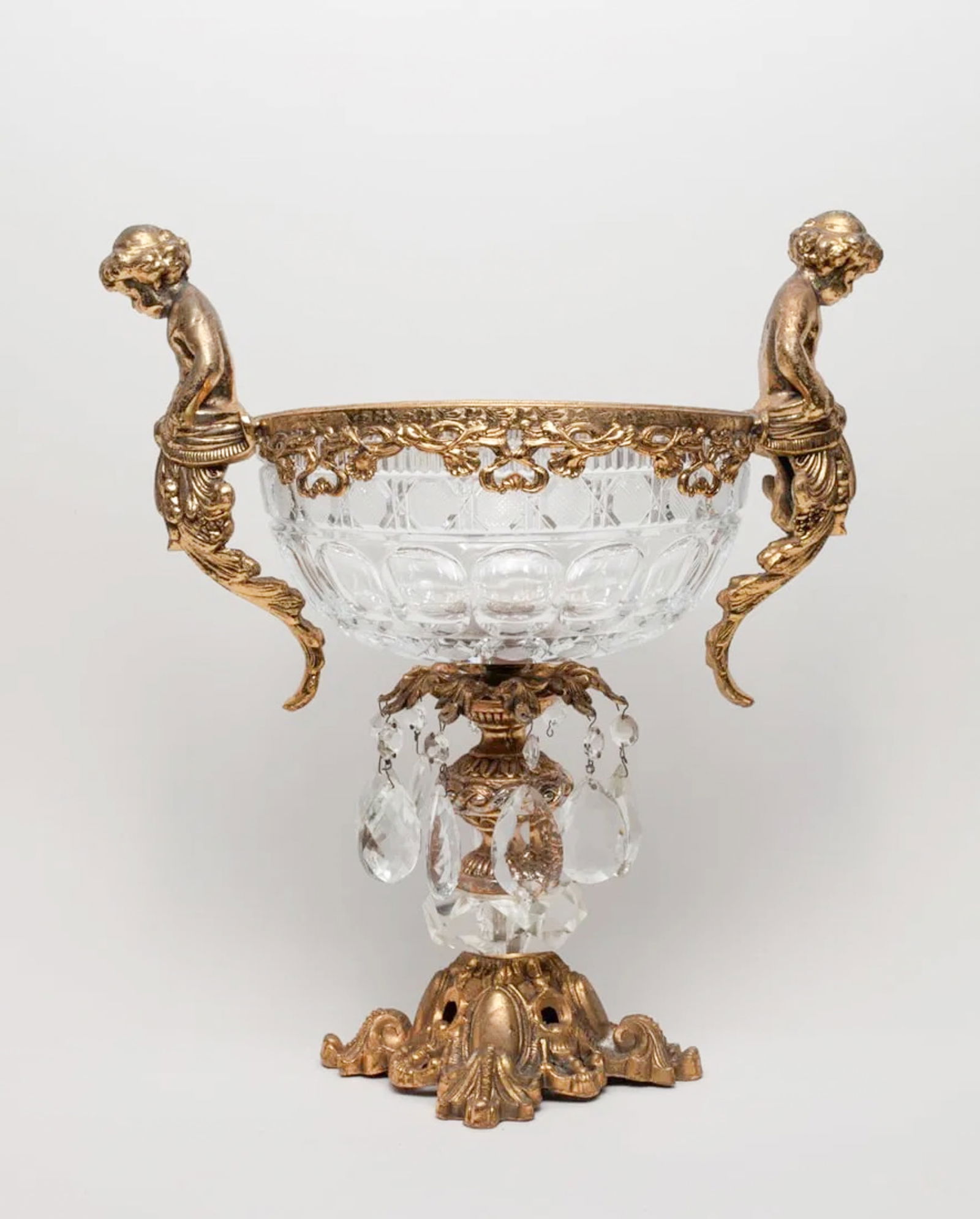 Tall France Gilt & Crystal Glass Bowl: French style crystal glass bowl supported on a gilt stand cast with foliage and pair of boy form handles. Approx. 11.7-8.6-15 inch.