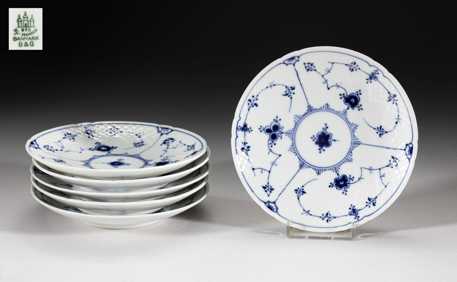 Bing & Grondahl Blue Fluted Plain SIX Saucers: Set of 6 blue and white porcelain saucers, decorated on the interior with foliage motif, each bottom marked Kjøbenhavn Denmark B&G. Approx. 5.3inch D (each).