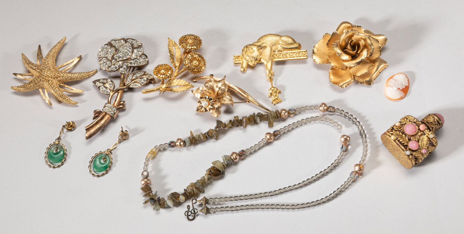 High Quality Gold Filled Jewelry: Collection of high quality gold filled jewelry pieces, including brooches, earrings, a fragrance bottle and a necklace. Size varies.
