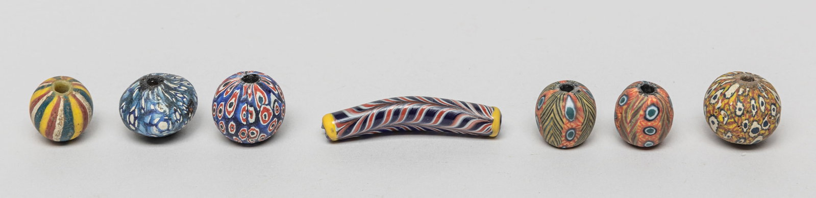 South Asian Banded & Eye Trade Beads: Group of 7 South Asian banded and eye pattern trade beads. Size varies.