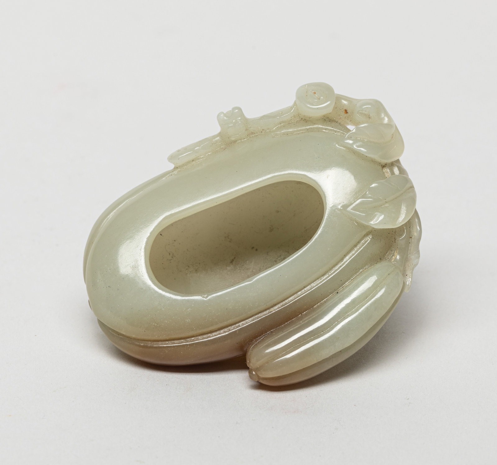 Chinese Jade Carved Gourd Washer: Chinese white and russet jade washer of gourd form, issuing from a short stem with leaves and a smaller gourd, a dragonfly along the sides. Approx. 2.7*2.2*1.1 inch.