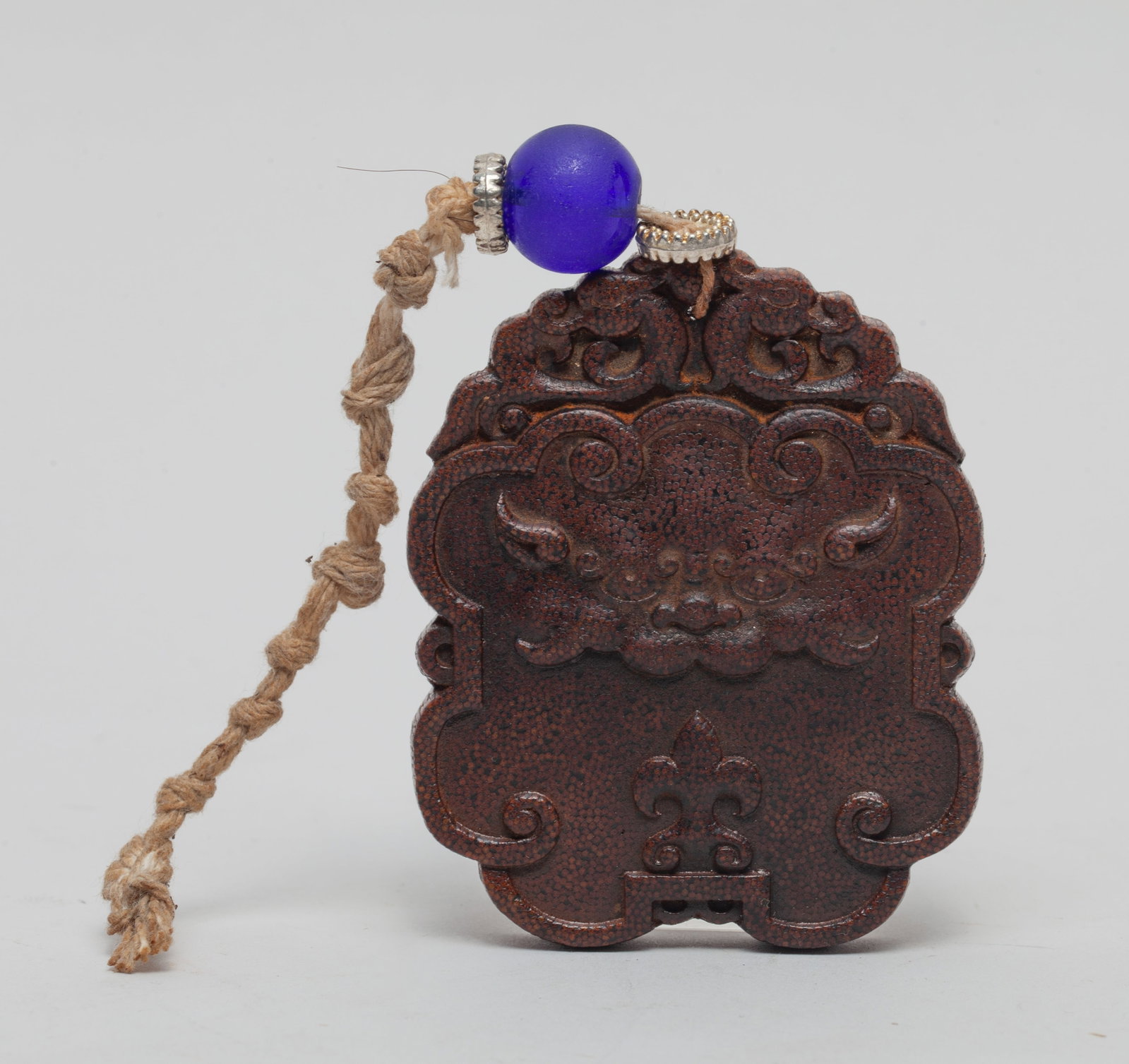 Chinese Export Plaque: One side carved with an archaic beast mask, the reverse with a seal mark, all beneath a pair of beasts, with a decor bead. Approx. 2.7*2.2 inch.