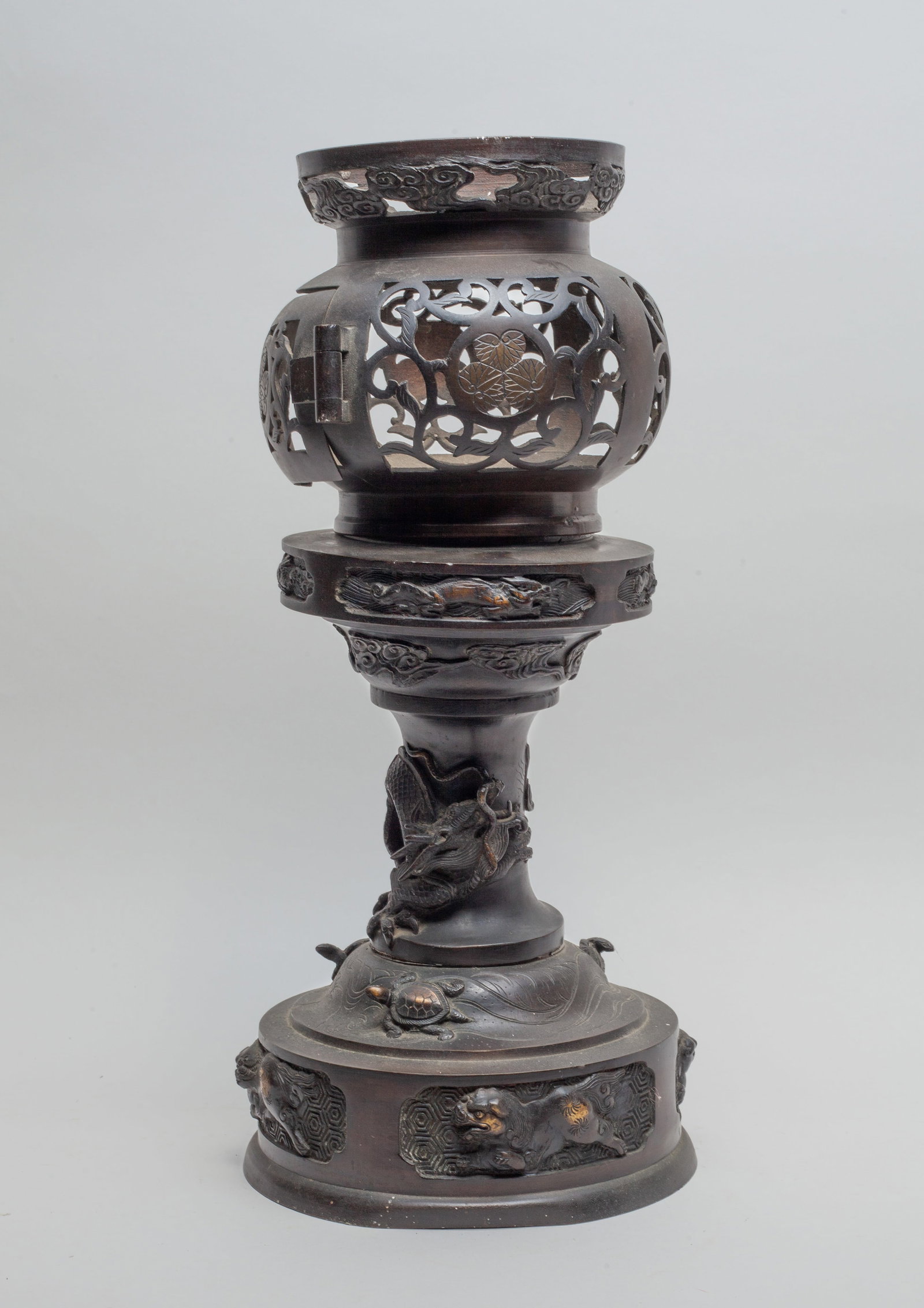 Japanese Meiji Dragon Vase: The globular body reticulated with floral motif, the shadt carved with beasts, clouds and dragon, the base cast in relief with turtles and beasts, Approx. 13.8*6.2 inch.